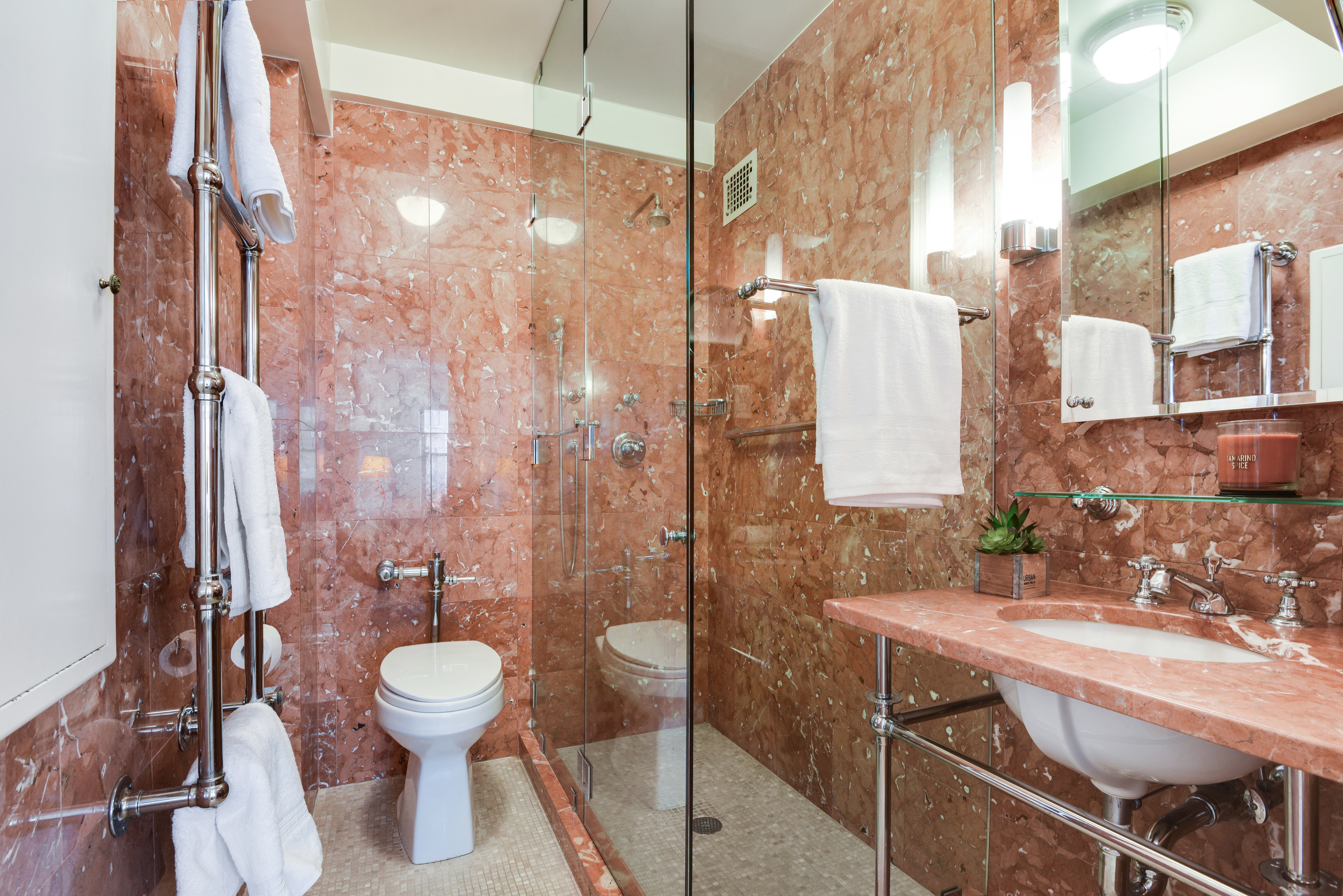 49 East 96th Street, Unit 8/9E Manhattan, NY 10128 - Photo 10 of 17 a bathroom with a sink toilet and shower