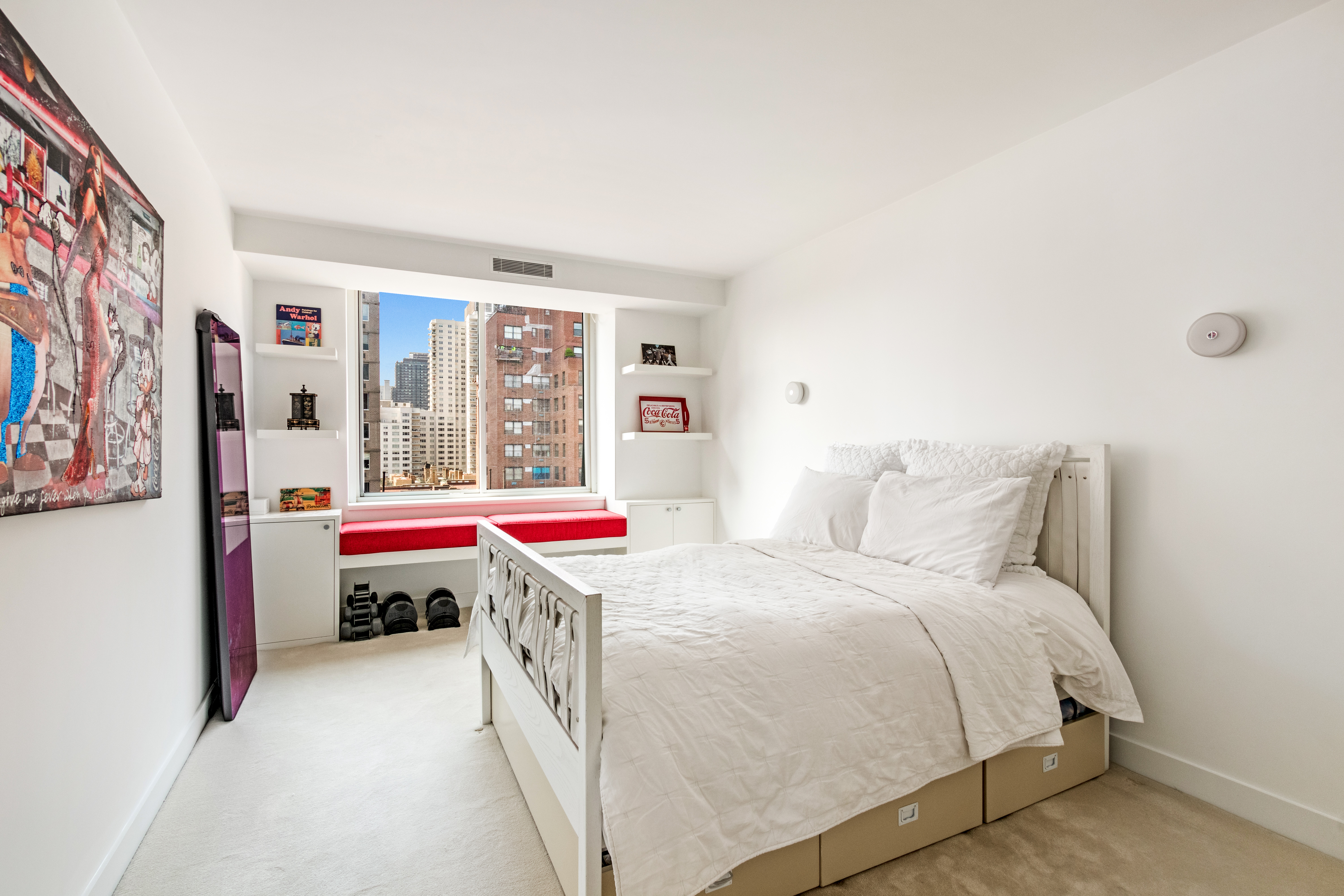 525 East 80th Street, Unit 11BC Manhattan, NY 10075 - Photo 11 of 16 a bedroom with a bed and a window