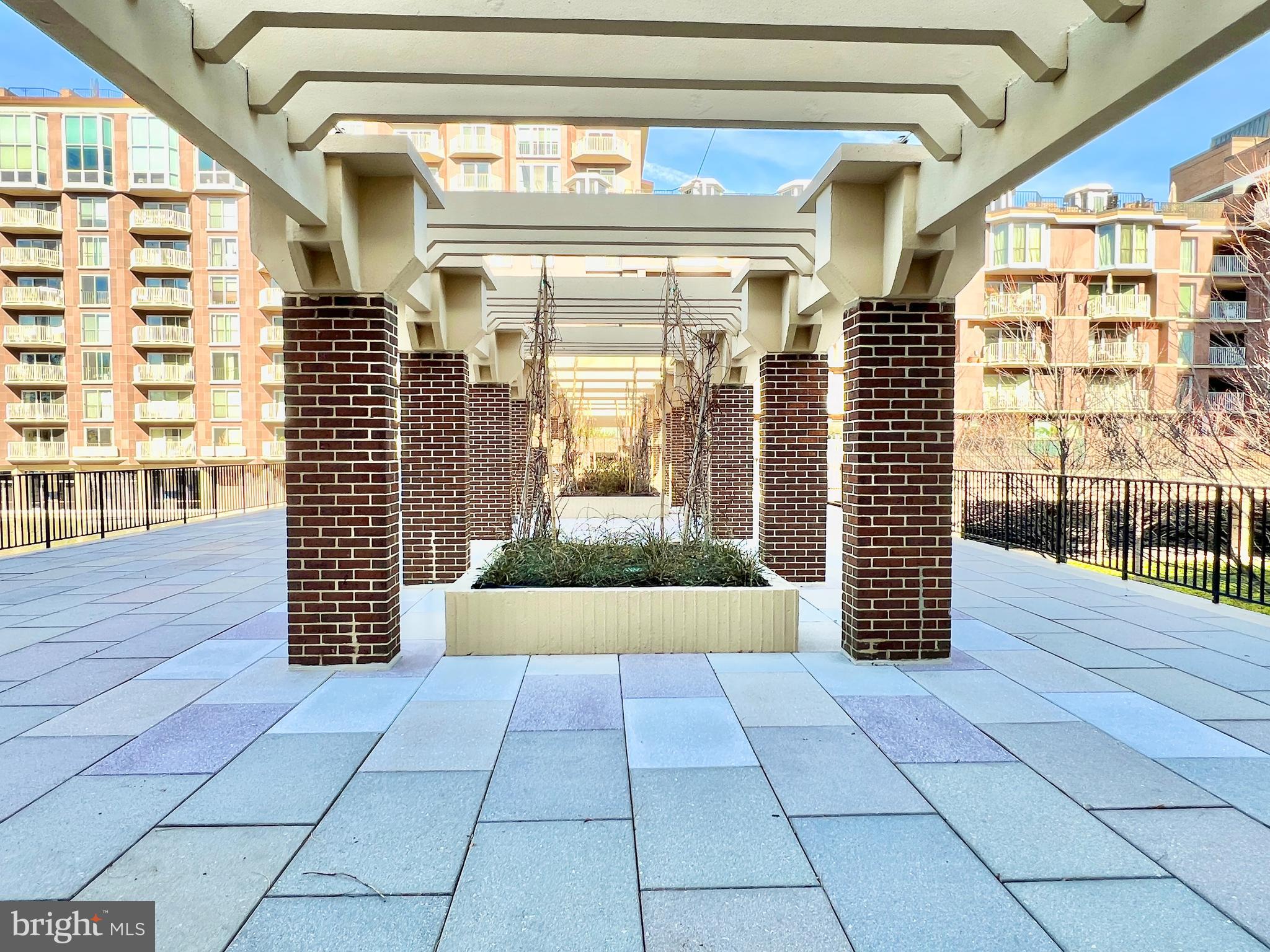 520 N Street Southwest, Unit S112 Washington, DC 20024 - Photo 23 of 45 a view of a pathway both side of building