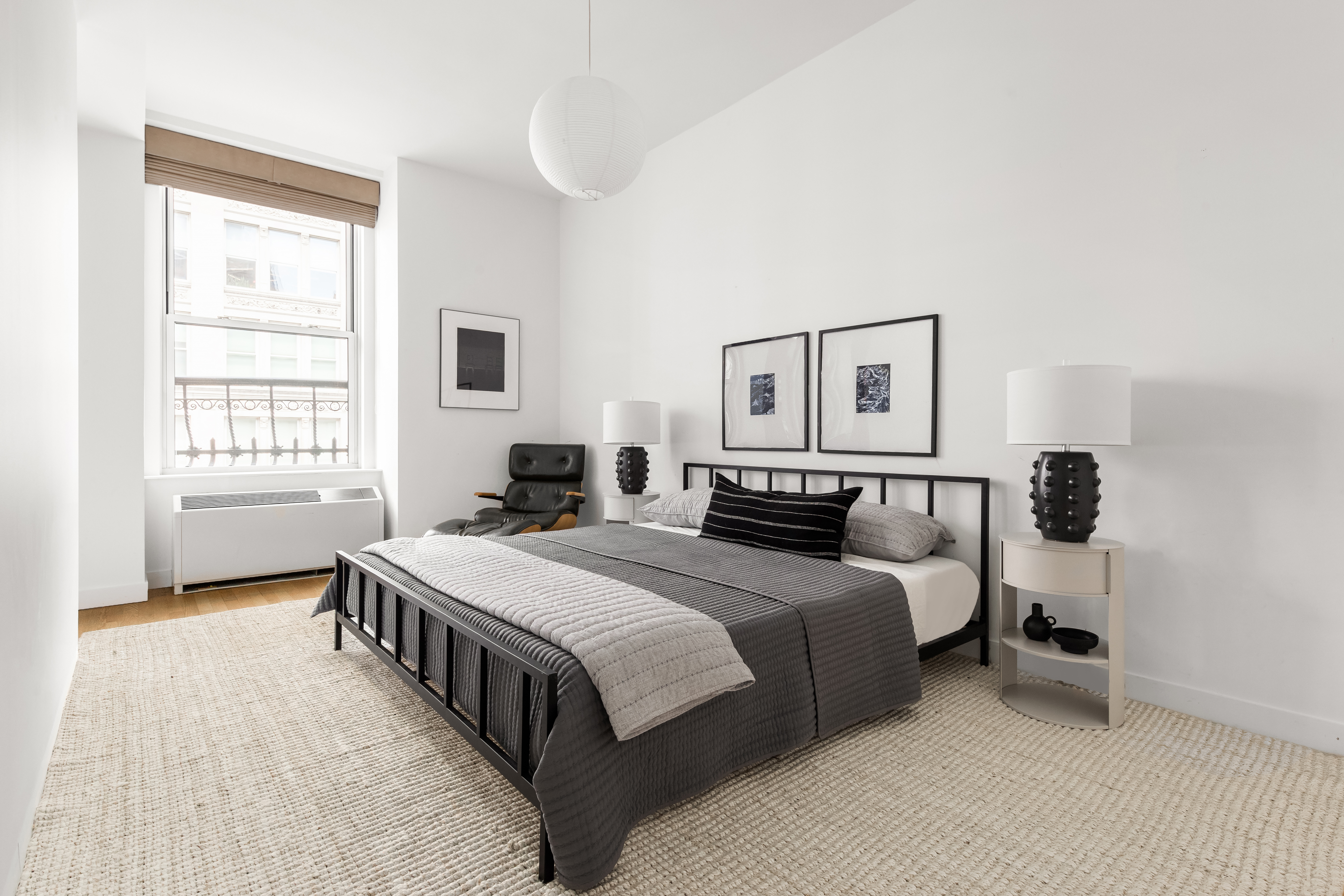 60 West 20th Street, Unit 4E Manhattan, NY 10011 - Photo 10 of 16 a bedroom with a bed and a window