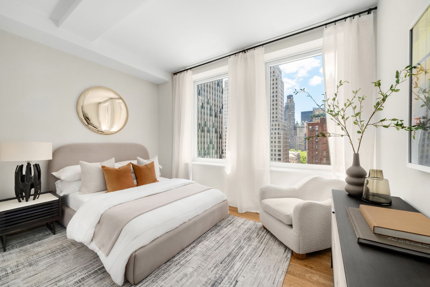 a bedroom with a bed and a couch