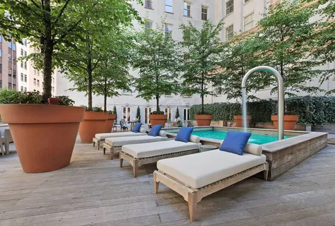 a view of an outdoor sitting area with couch and trees