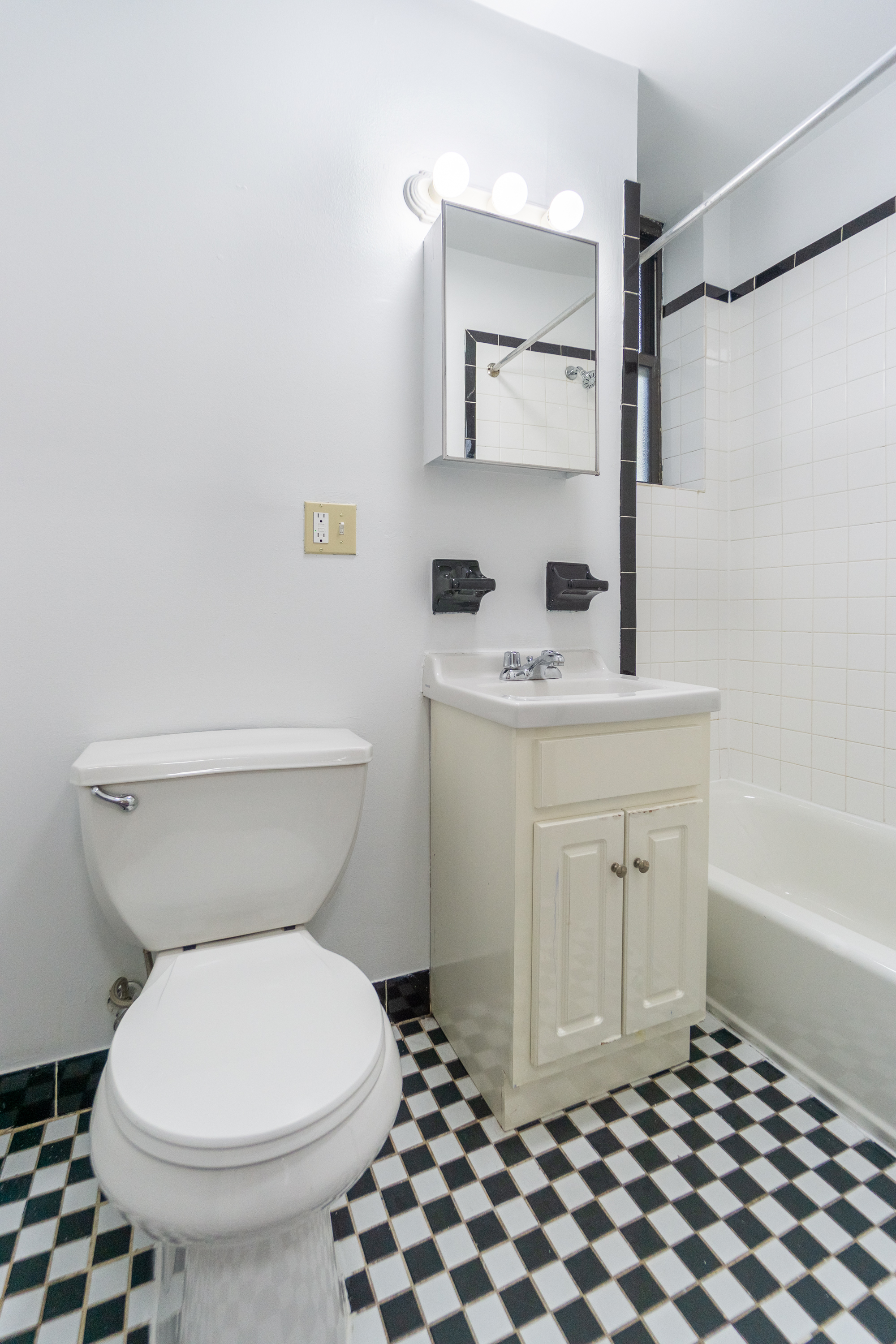 319 East 25th Street, Unit 5C Manhattan, NY 10010 - Photo 6 of 14 a bathroom with a sink toilet and shower