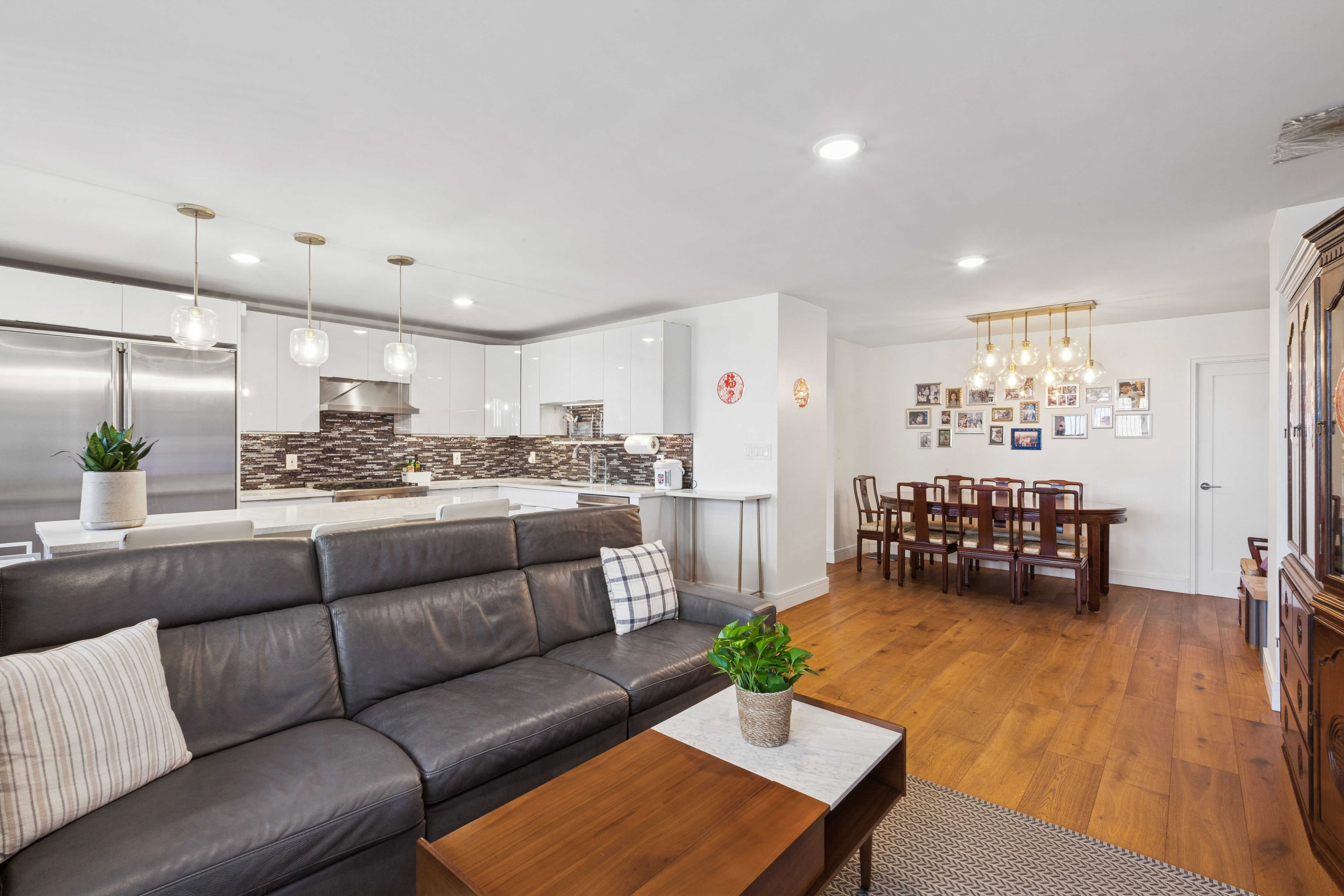 70-25 Yellowstone Boulevard, Unit 8N Queens, NY 11375 - Photo 3 of 19 a living room with furniture and kitchen view
