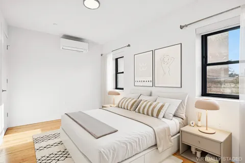 a bedroom with a bed and a lamp