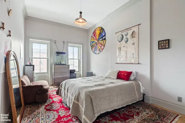 a bedroom with a bed and furniture