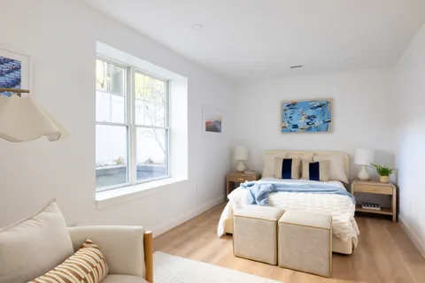 a living room with a couch next to a window