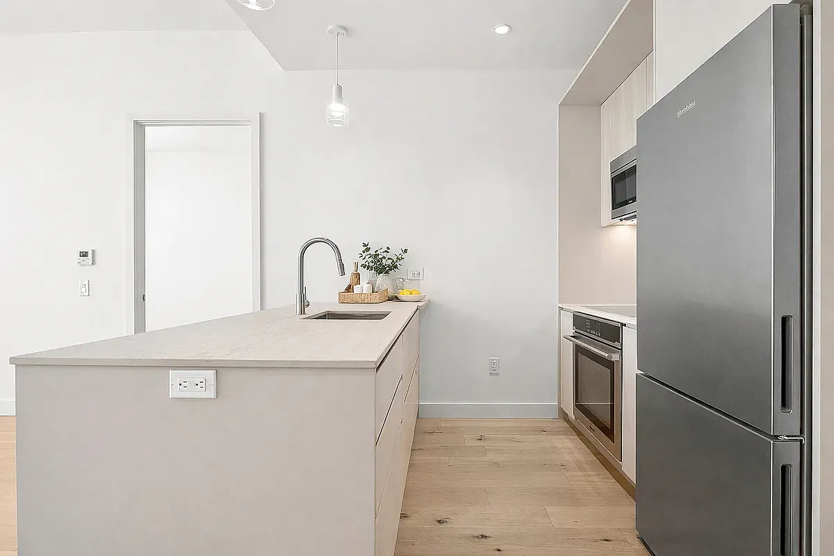 130 2nd Street, Unit 9B Brooklyn, NY 11231 - Photo 3 of 19 a kitchen with a sink a refrigerator and cabinets