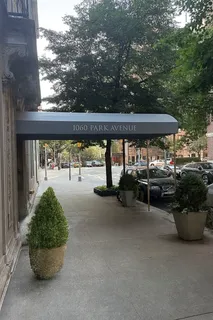 a view of a patio with table and chairs and potted plants