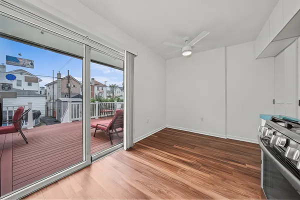 a view of a livingroom with wooden floor