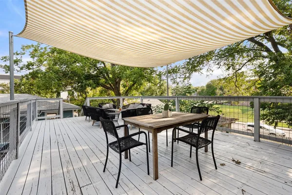 a view of a table and chairs on the roof deck