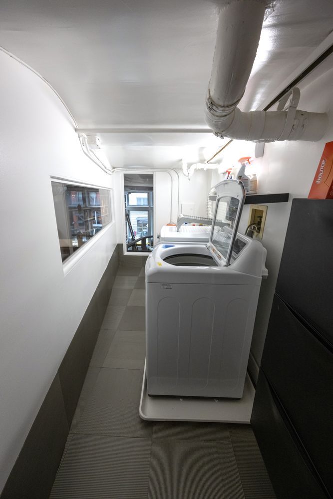 382 Lafayette Street, Unit 2 Manhattan, NY 10003 - Photo 18 of 19 a room with water heater and white walls