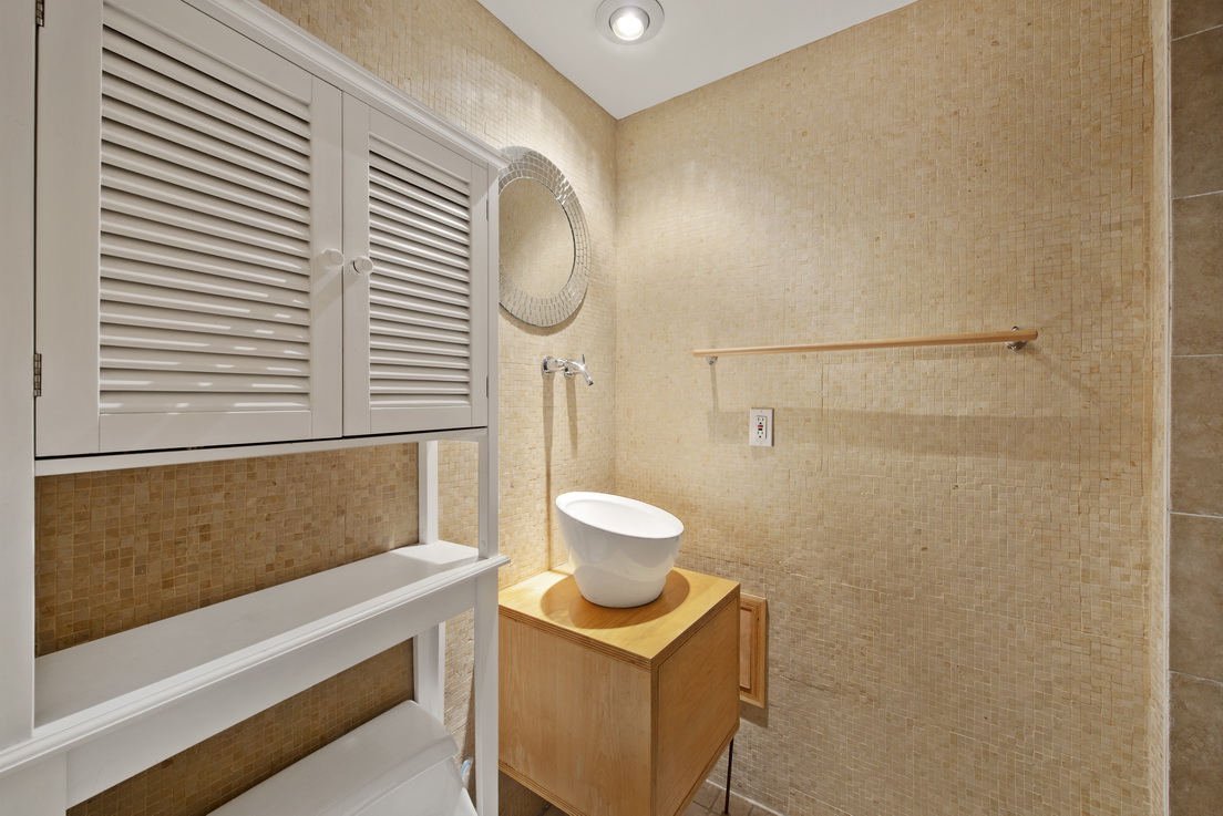 304 Lafayette Avenue, Unit GARDEN Brooklyn, NY 11238 - Photo 7 of 10 a bathroom with a sink and a mirror