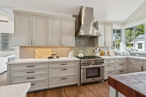 a kitchen with a stove and a sink