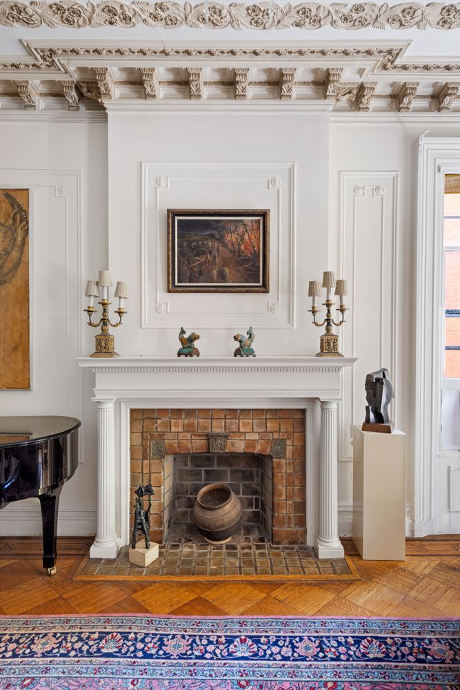 315 Washington Avenue Brooklyn, NY 11205 - Photo 6 of 38 a living room with furniture and a fireplace