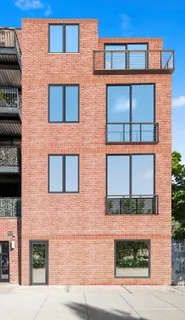 a brick building that has a sign on it