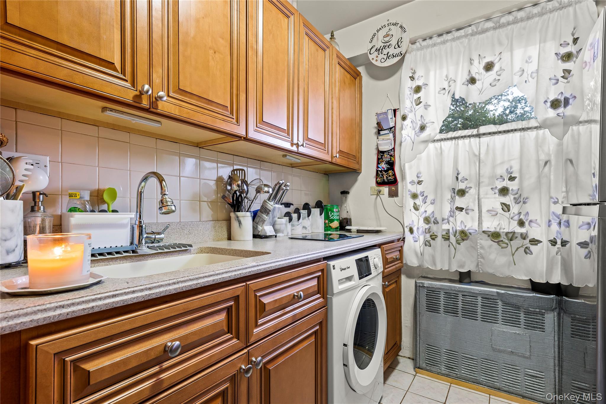 12399 Flatlands Avenue, Unit 1L Brooklyn, NY 11207 - Photo 6 of 21 a kitchen with stainless steel appliances granite countertop a sink and cabinets