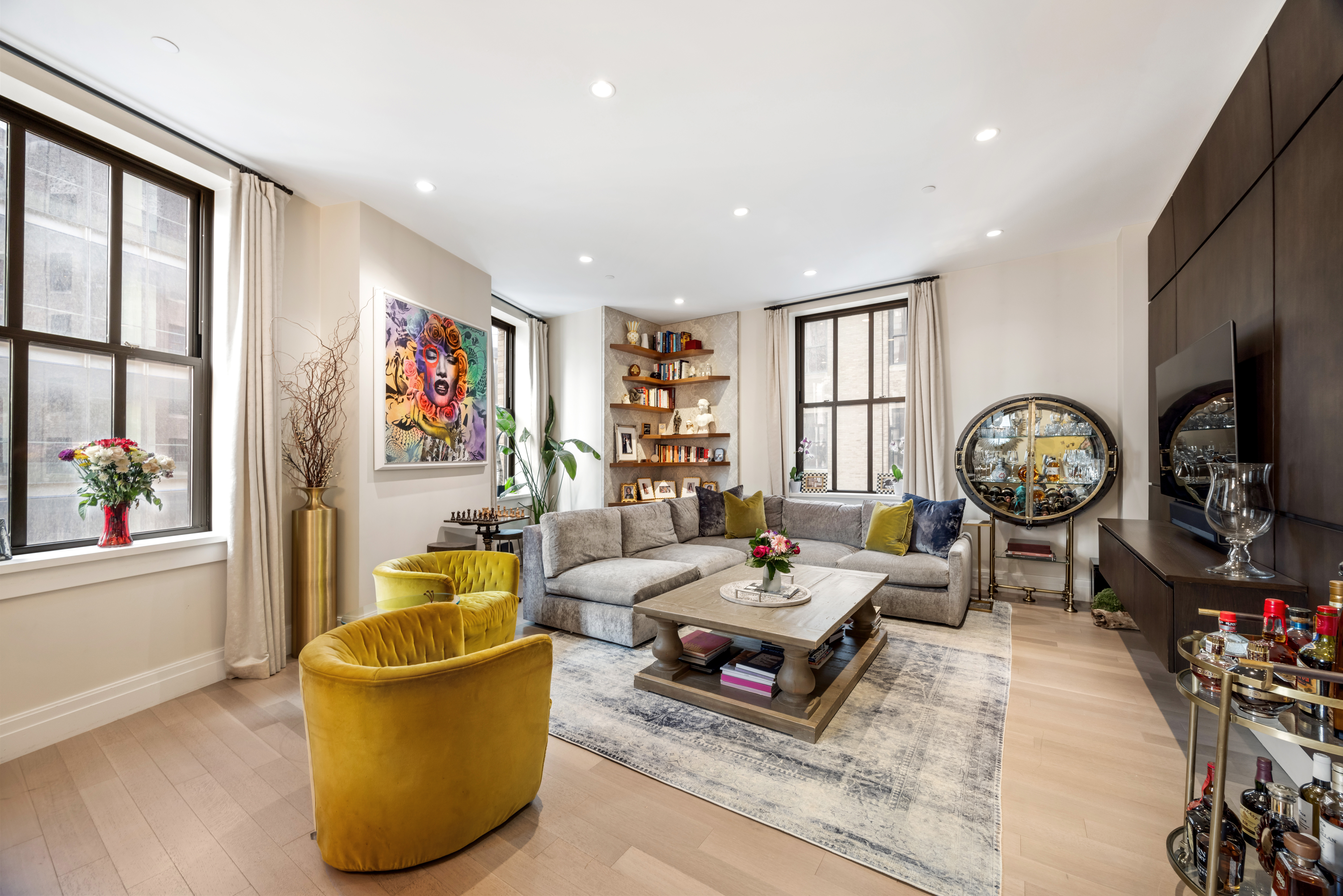 100 Barclay Street, Unit 13G Manhattan, NY 10007 - Photo 2 of 26 a living room with furniture a rug and a window