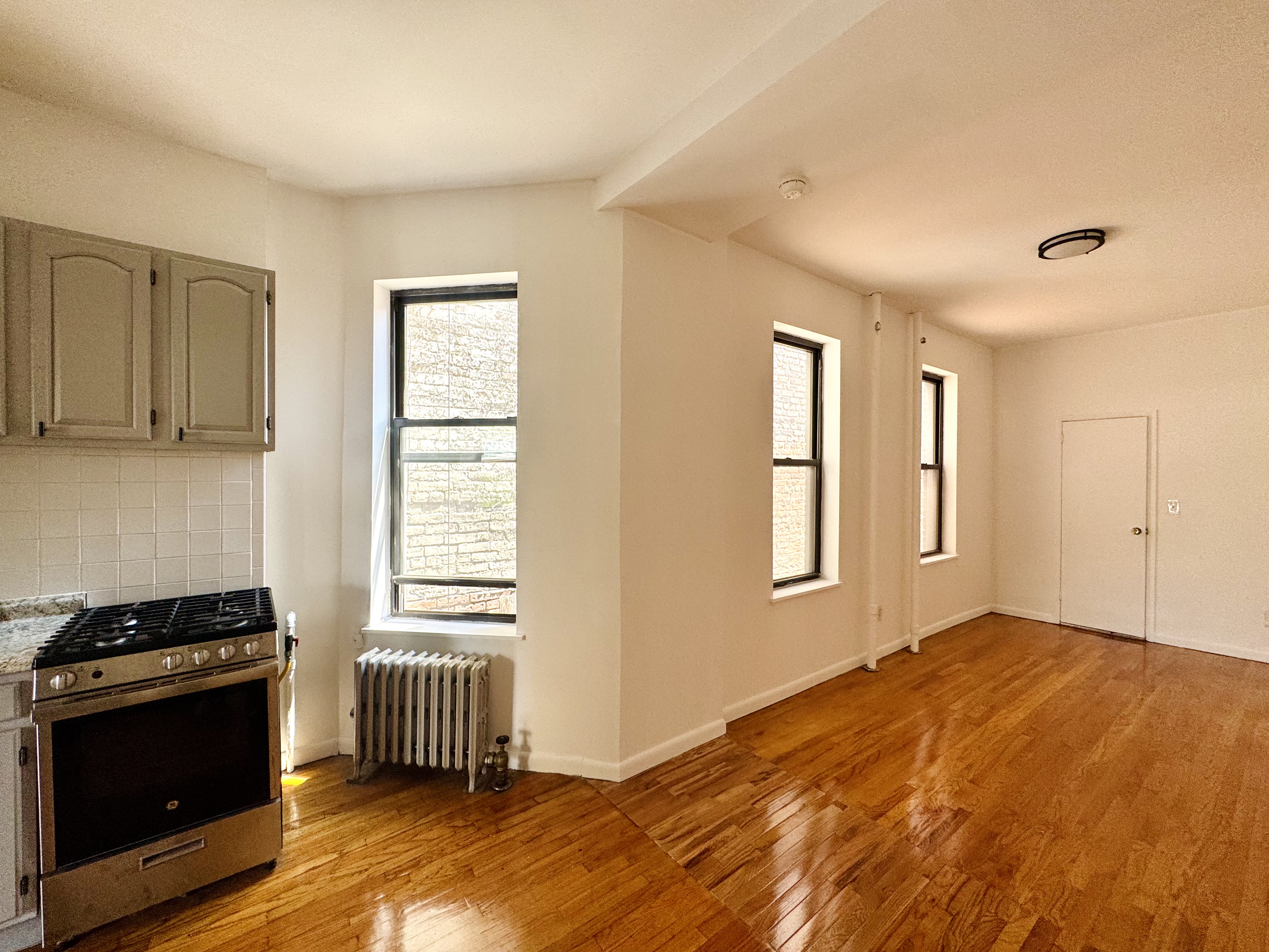 306 East 11th Street, Unit 5B Manhattan, NY 10003 - Photo 5 of 8 a bedroom with a bed and a window