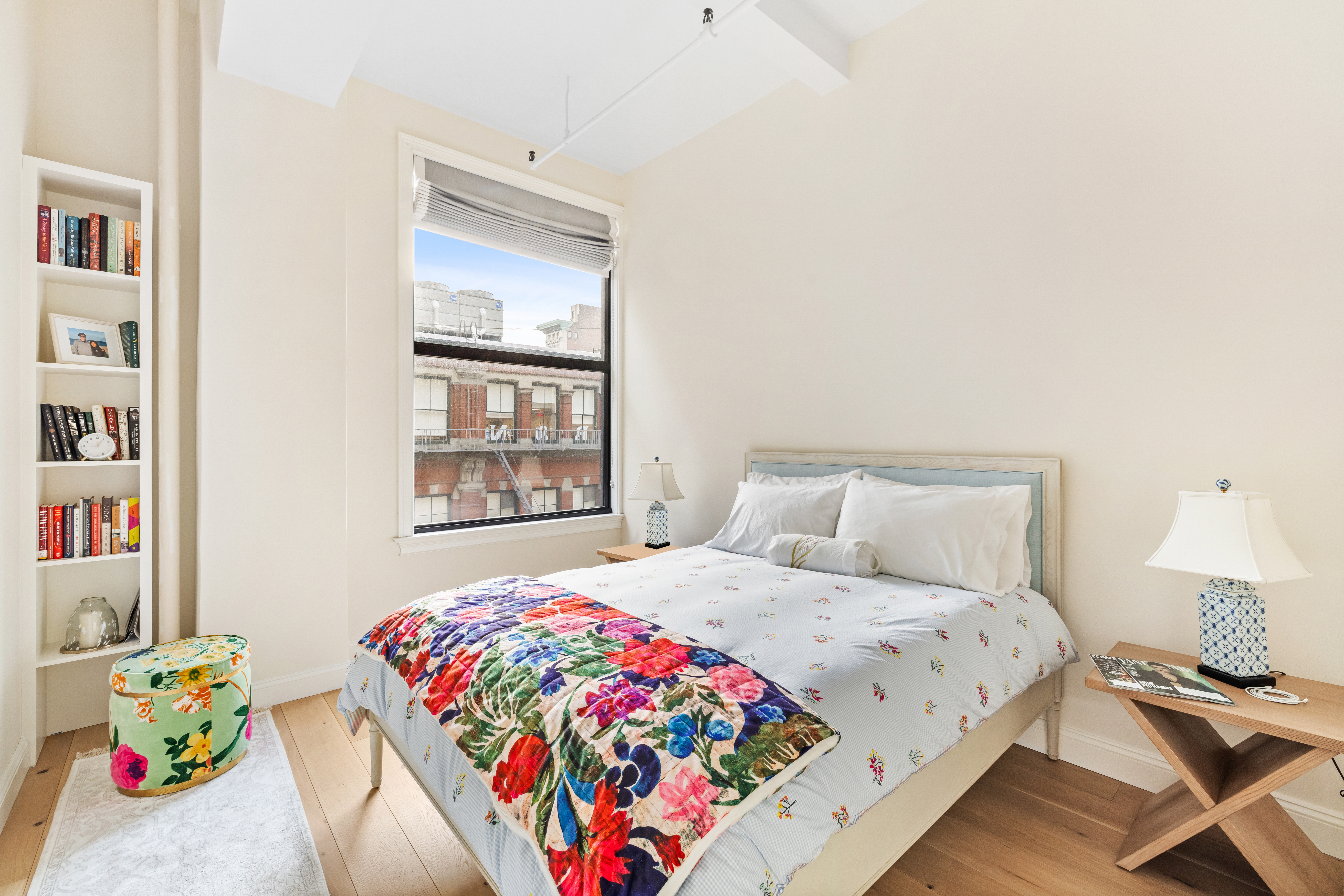 222 Park Avenue South, Unit 8D Manhattan, NY 10003 - Photo 7 of 9 a bedroom with a bed and a window