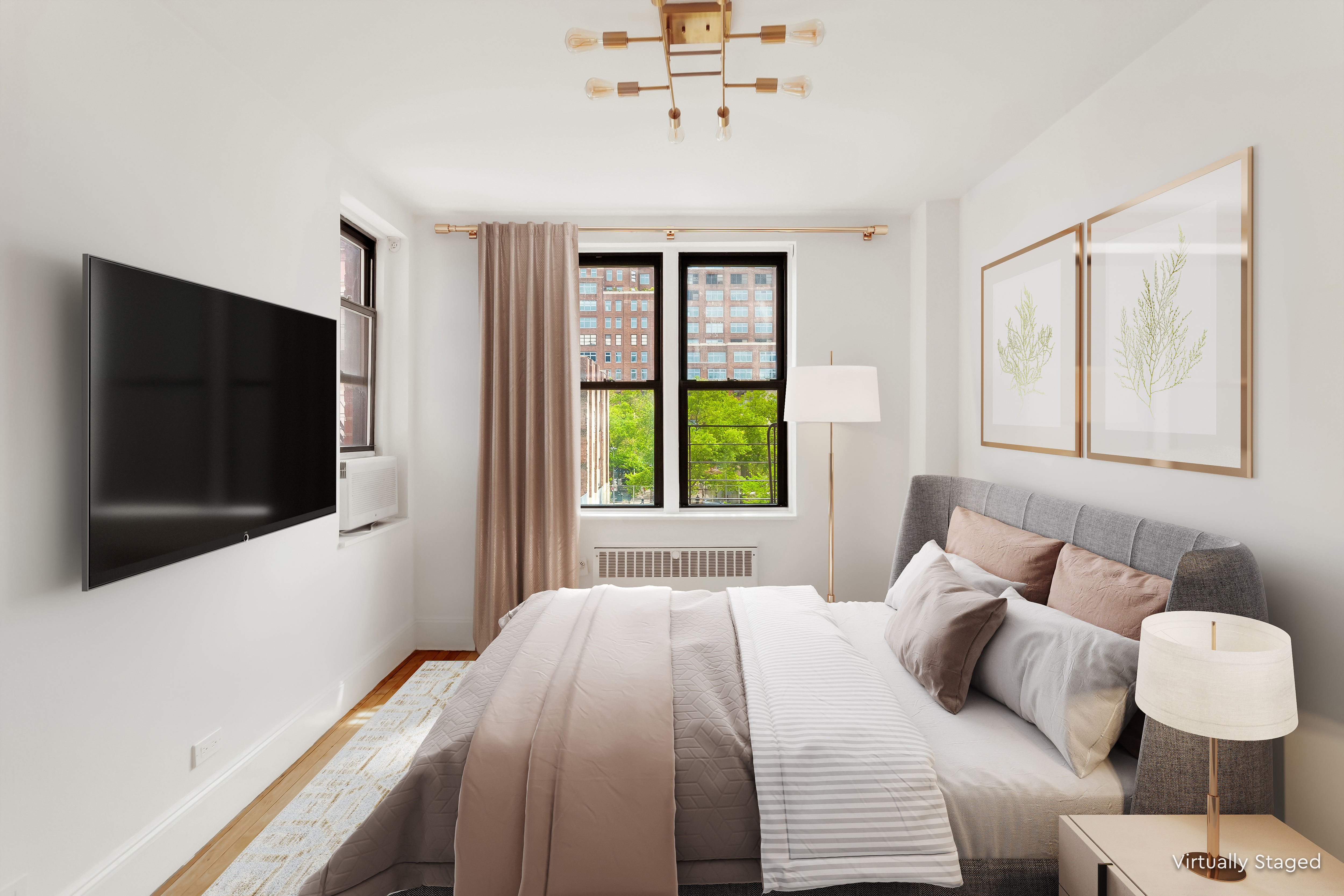 305 West 18th Street, Unit 4C Manhattan, NY 10011 - Photo 2 of 7 a bedroom with a bed and a flat screen tv