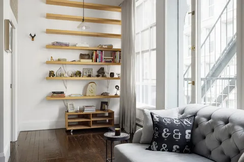 a bedroom with furniture and a window