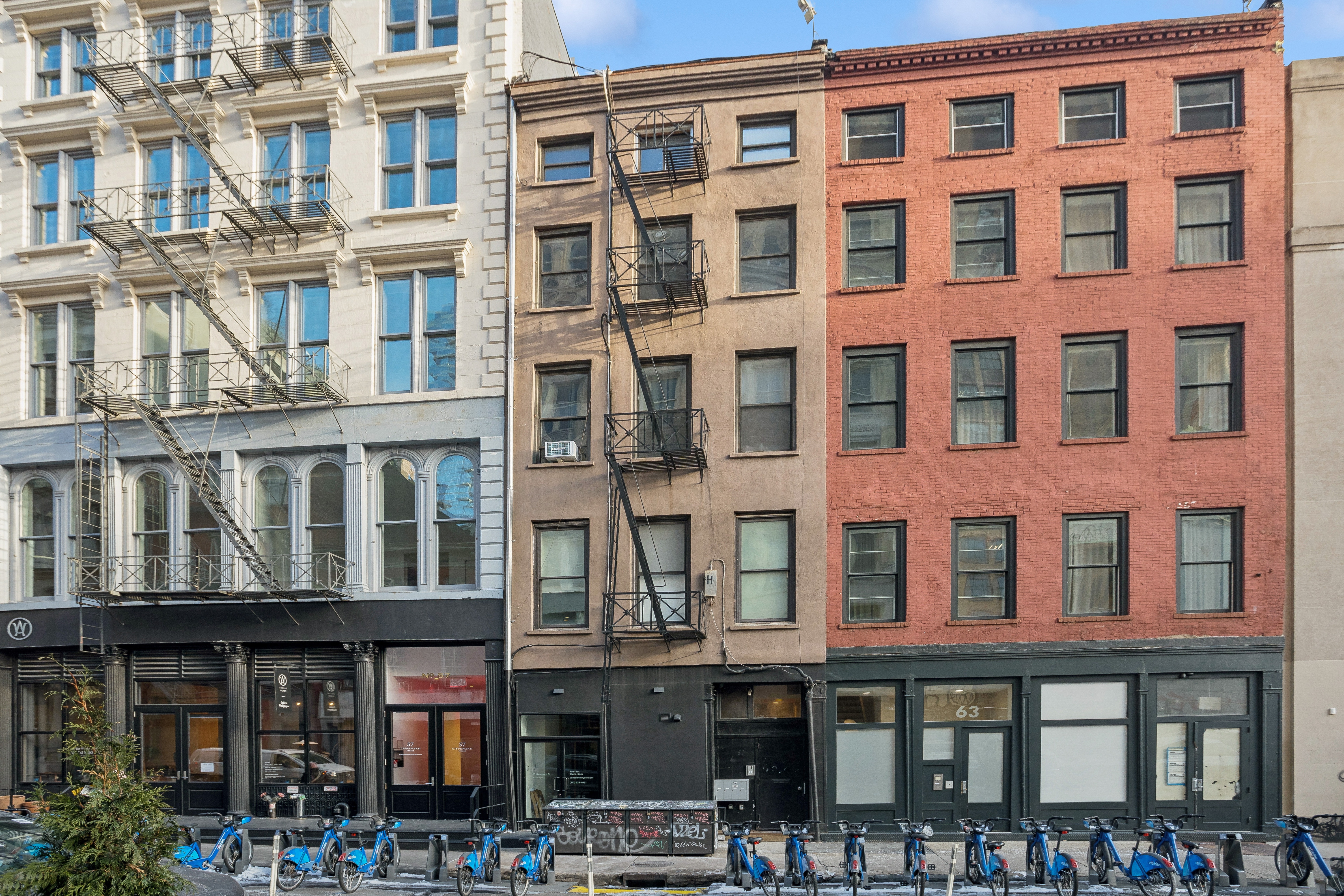 61 Lispenard Street, Unit 4 Manhattan, NY 10013 - Photo 8 of 8 a front view of a building with glass windows