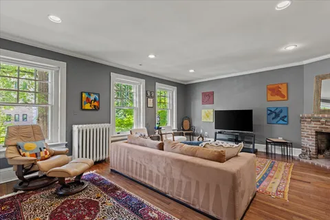 a large bedroom with a bed and a chandelier