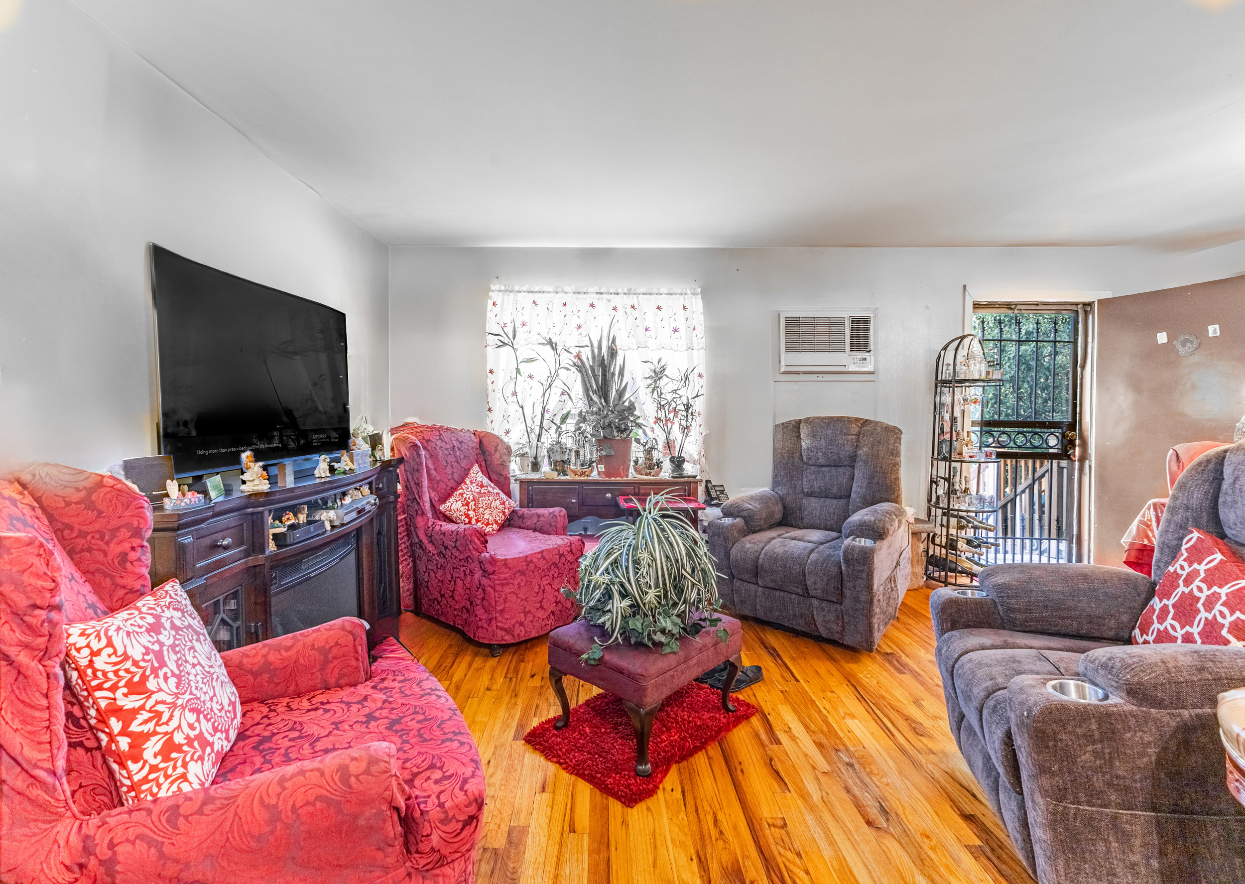 669 Dekalb Avenue Brooklyn, NY 11216 - Photo 6 of 21 a living room with furniture and a flat screen tv