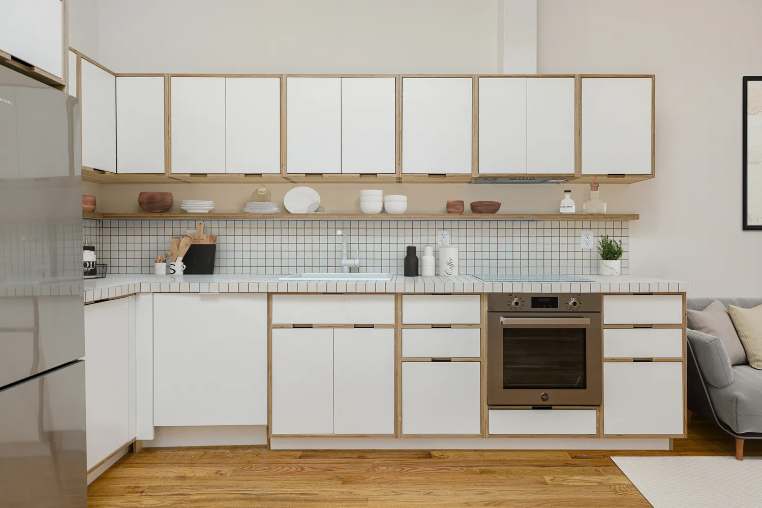 a kitchen with stainless steel appliances a sink stove and cabinets