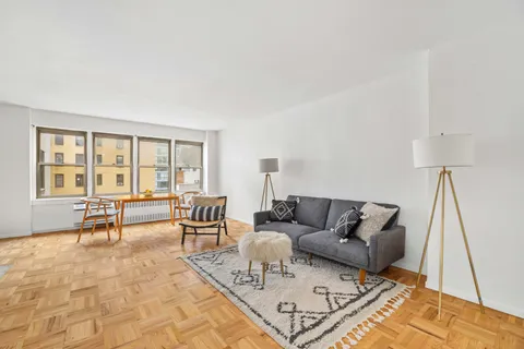 a living room with furniture and a window