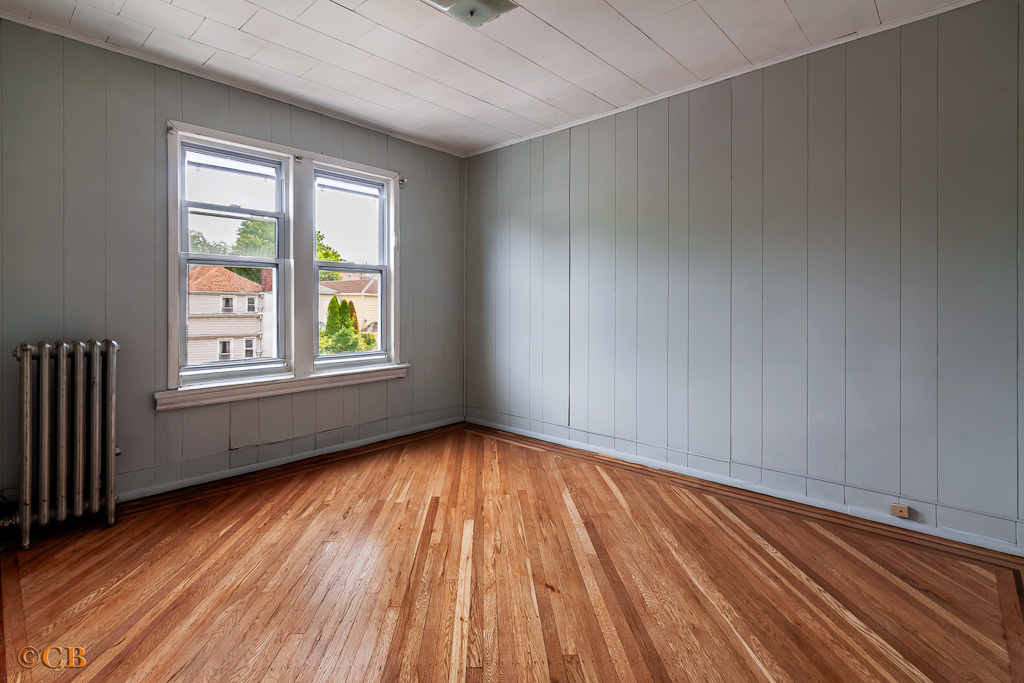 1221 Troy Avenue Brooklyn, NY 11203 - Photo 6 of 10 wooden floor in an empty room with a window
