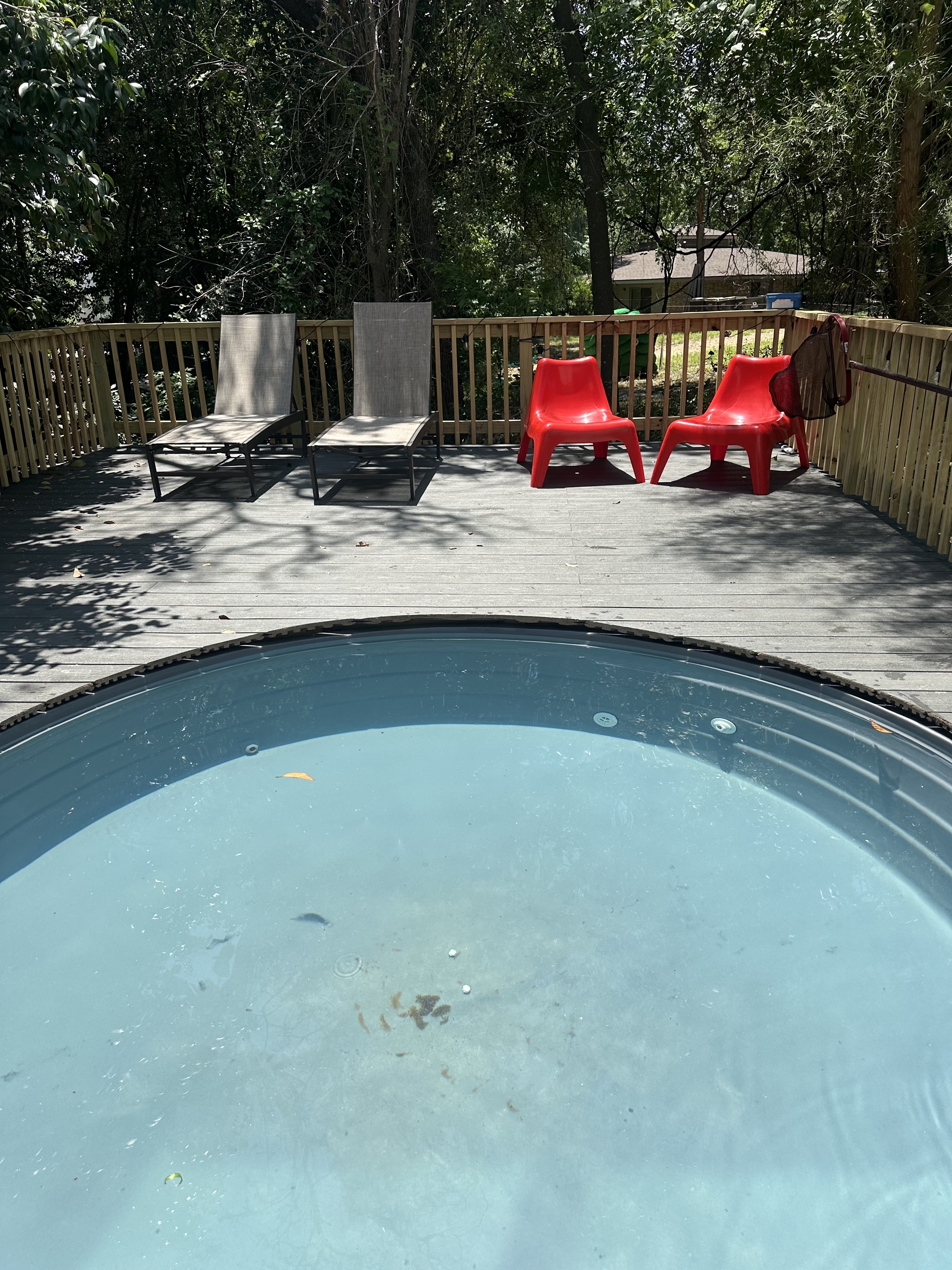 107 Blue Ridge Trail Austin, TX 78746 - Photo 38 of 38 a view of a wooden deck and a backyard