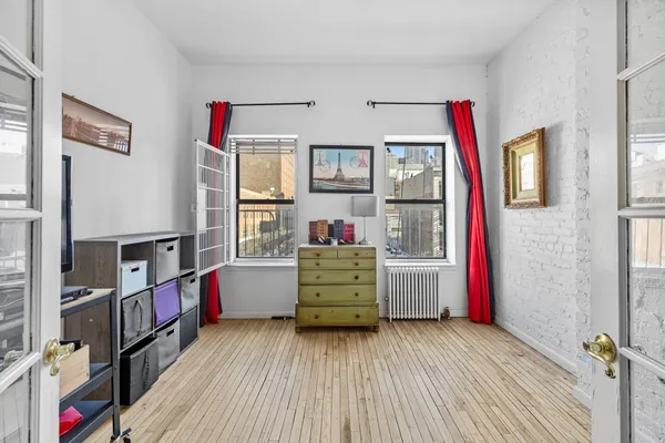 a bed room with a bed and a window