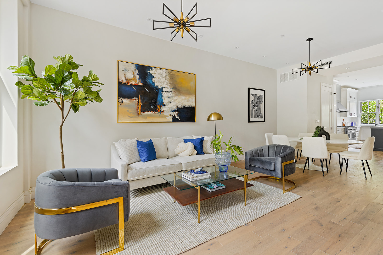 a living room with furniture a chandelier and a window