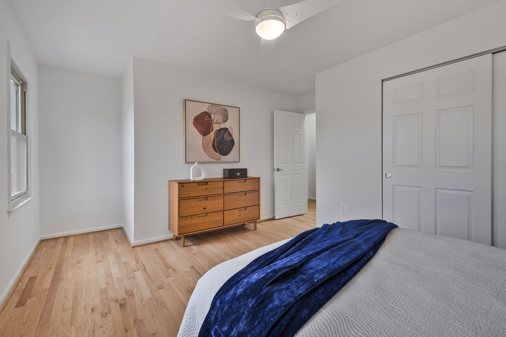 4008 Evangeline Terrace Olney, MD 20832 - Photo 34 of 54 a bedroom with a bed and wooden floor