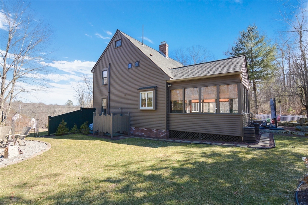 187 Blackstone Street Mendon, MA 01756 - Photo 7 of 42 a front view of a house with a yard