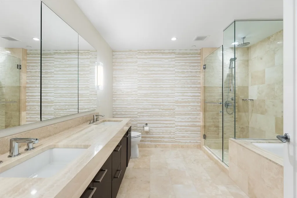 a bathroom with a bathtub and shower