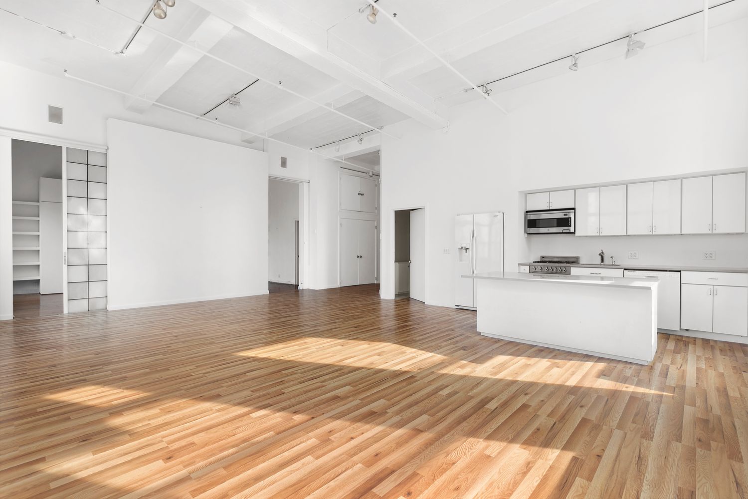 448 West 37th Street, Unit PHA Manhattan, NY 10018 - Photo 4 of 7 a view of kitchen with microwave and cabinets