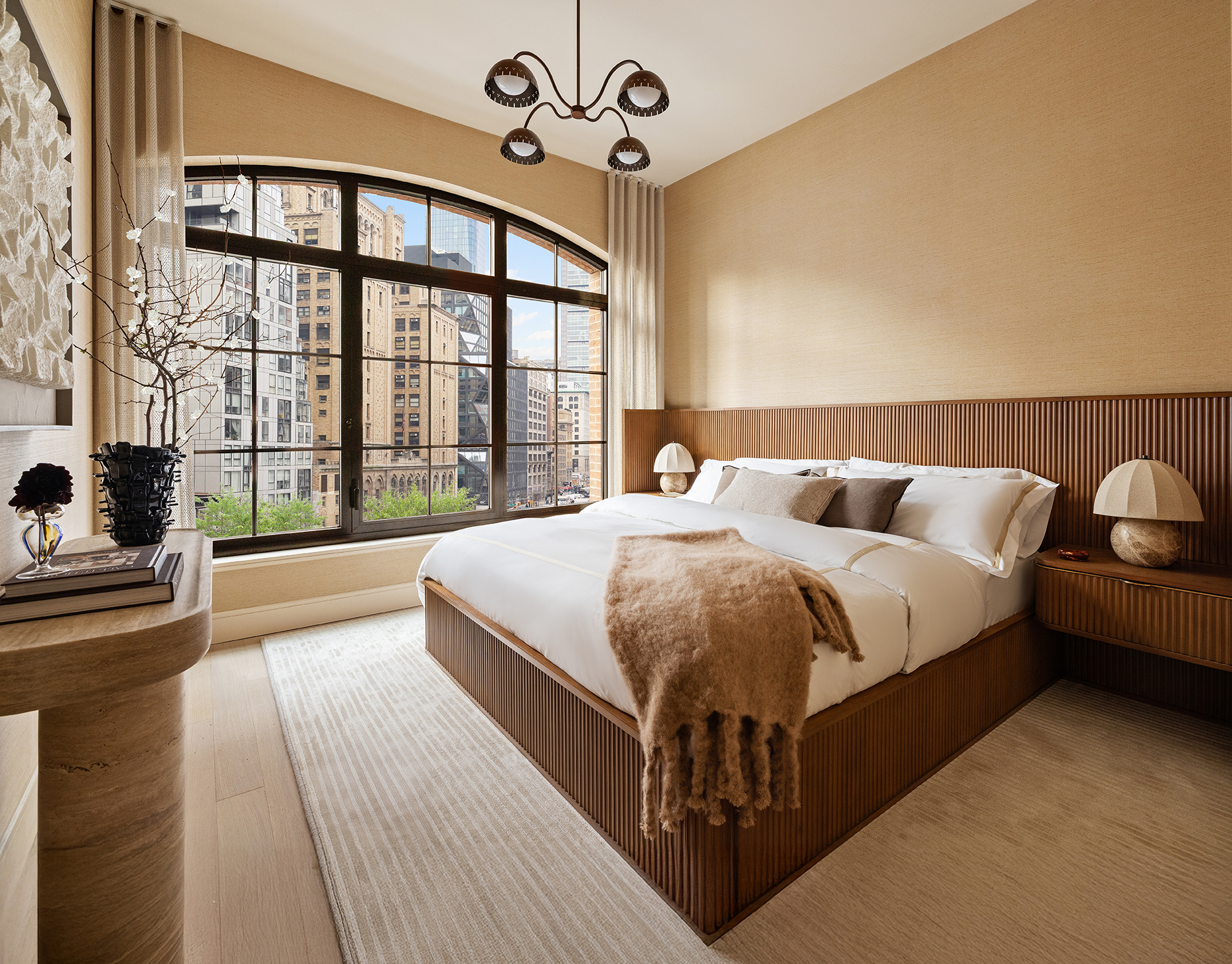 201 East 23rd Street, Unit 5B Manhattan, NY 10010 - Photo 4 of 23 a bedroom with a large bed and a large window