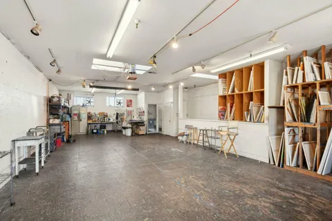 a view of a livingroom with furniture and a garage