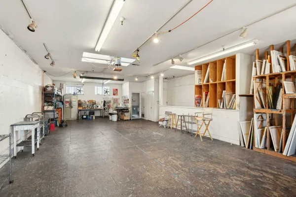 a view of a livingroom with furniture and a garage