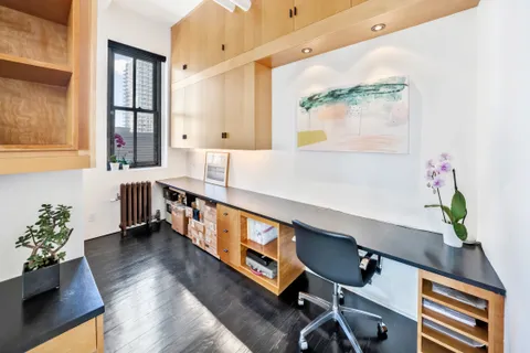 a view of an entryway with wooden floor