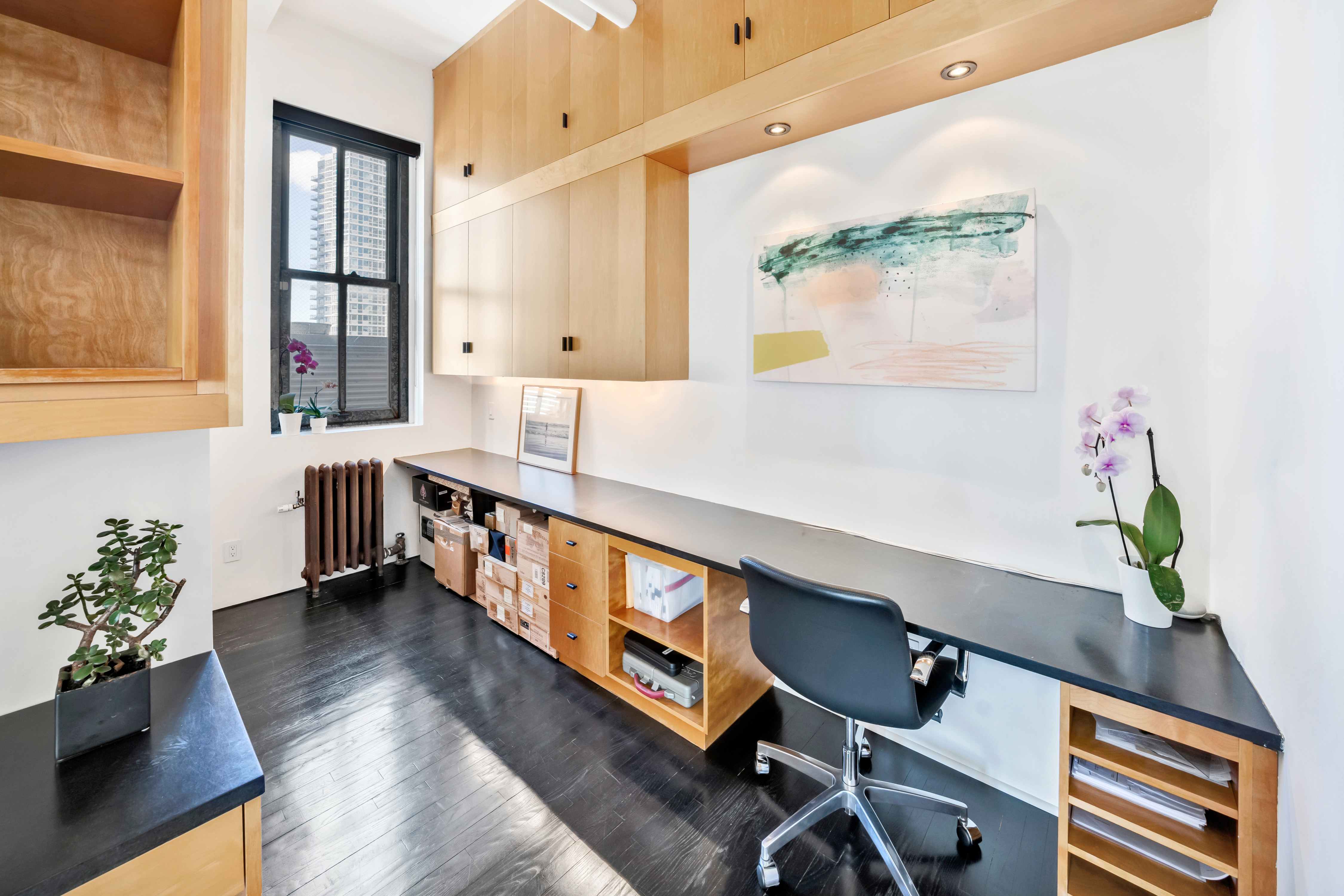 448 West 37th Street, Unit 11G/12G Manhattan, NY 10018 - Photo 8 of 17 a view of an entryway with wooden floor