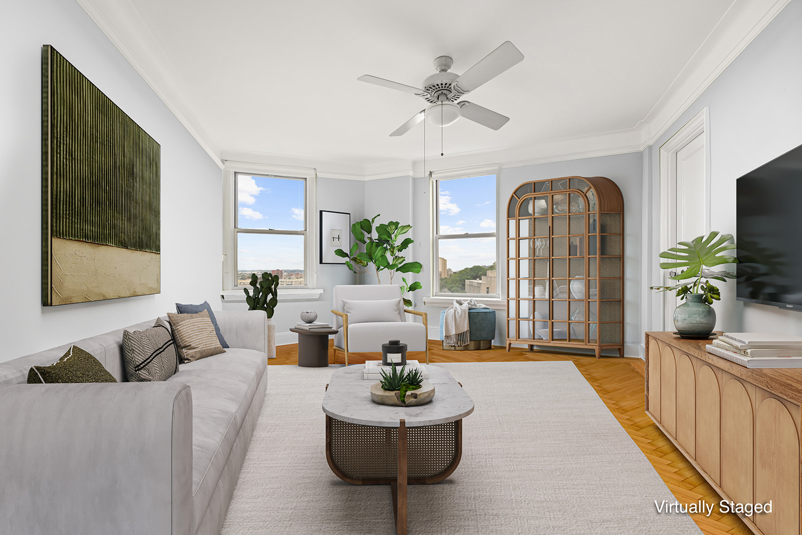 a living room with furniture and a potted plant