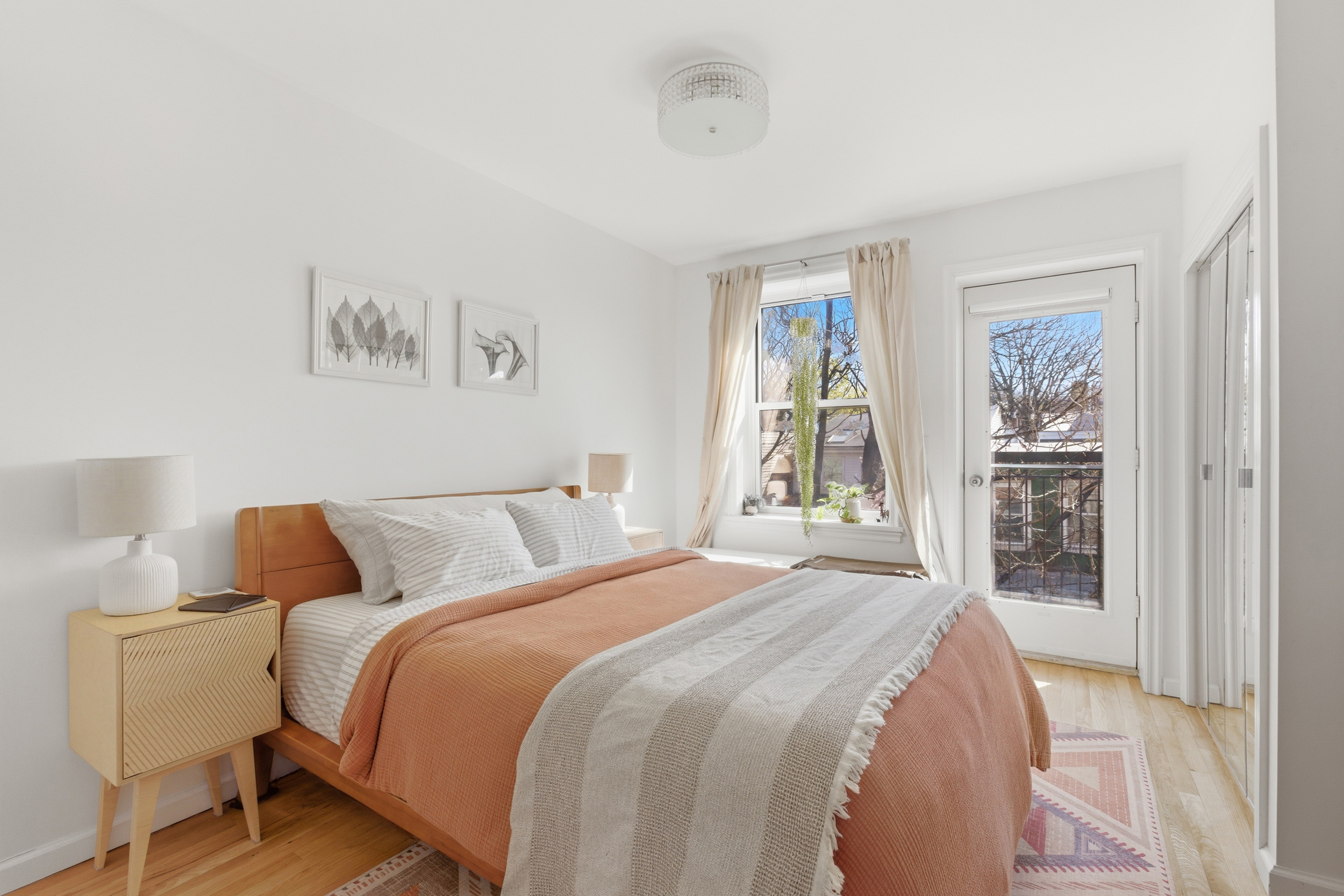 392 11th Street, Unit 3A Brooklyn, NY 11215 - Photo 4 of 11 a bedroom with a large bed and a window