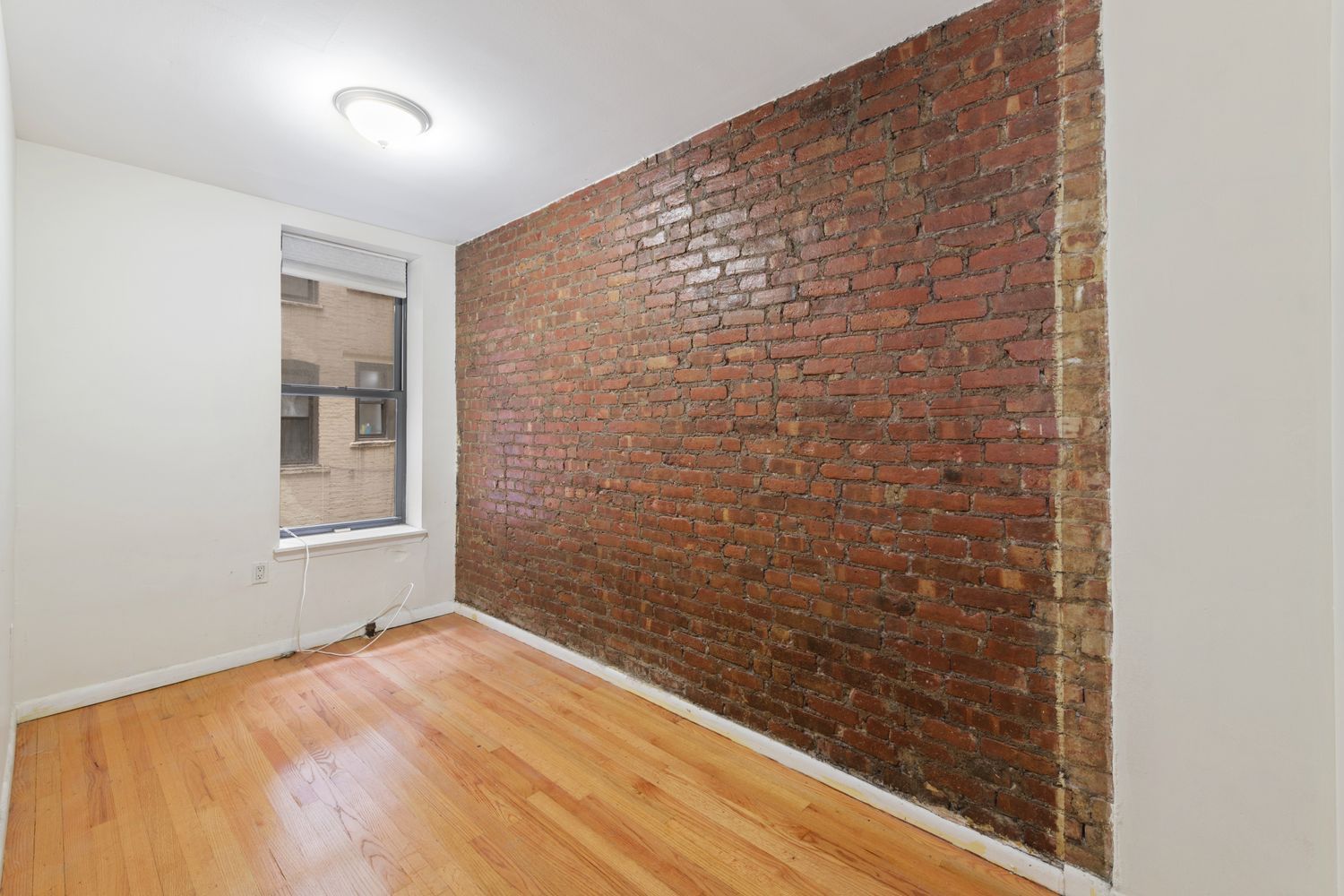 309 East 95th Street, Unit 23 Manhattan, NY 10128 - Photo 4 of 6 a view of an empty room