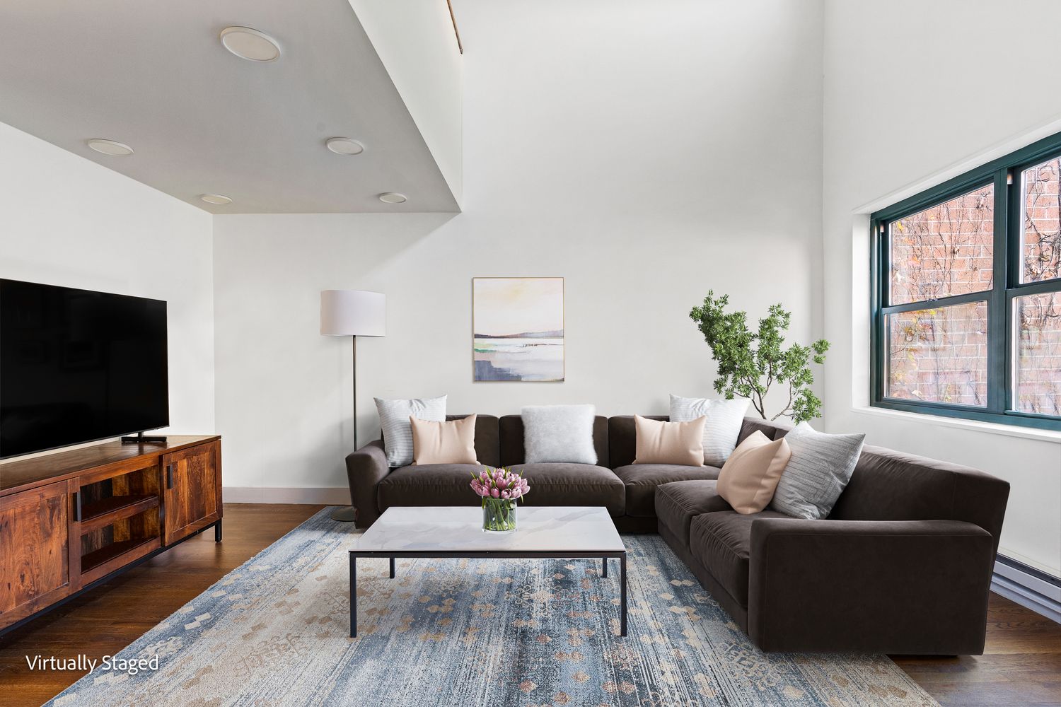 a living room with furniture and a flat screen tv