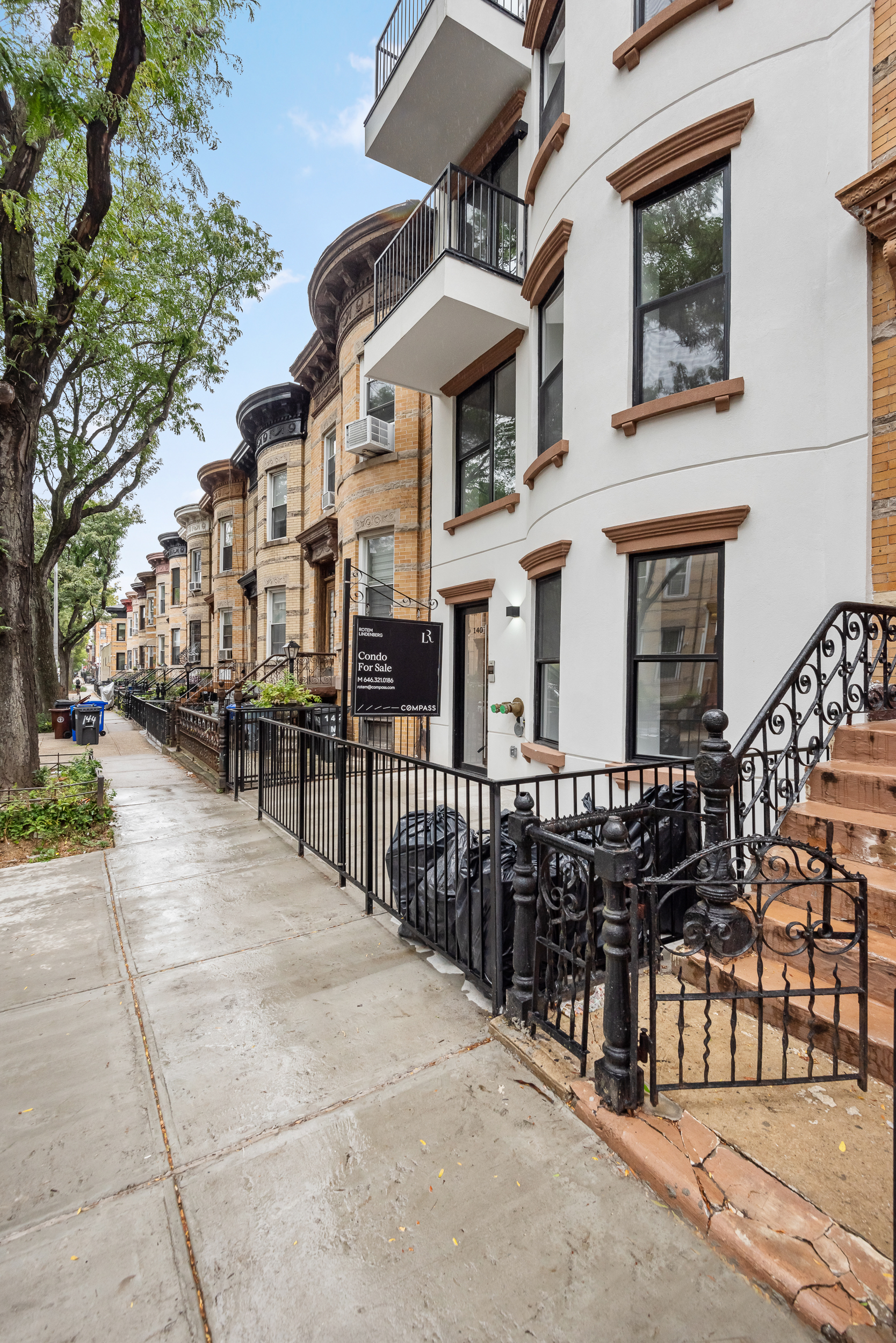140 Moffat Street, Unit 1 Brooklyn, NY 11207 - Photo 8 of 9 front view of a brick house with large windows