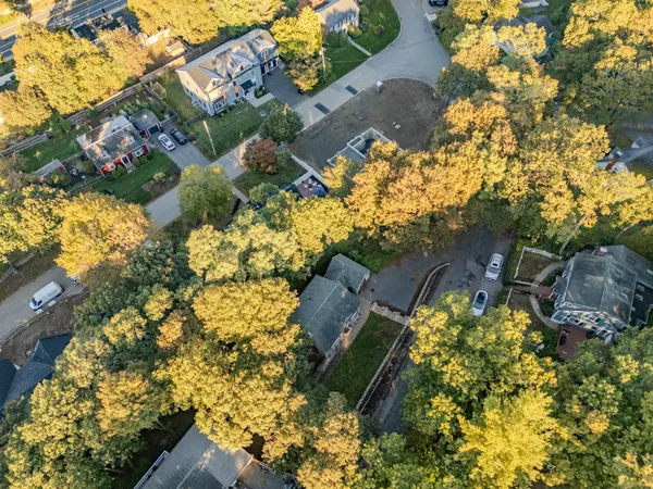 a aerial view of a house with a yard and garden